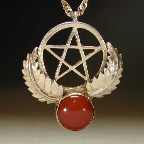 The pentagram has long been associated with protection in many cultures. The knights of the crusades had the star placed on their shields as a protective talisman. Where the symbol of the cross represented the Christs suffering the pentacle represented his protection. This Sterling silver piece is set with a 12mm round carnelian, a popular stone from ancient Egypt through the middle ages, and the Renaissance. This stone is associated with protection and courage.