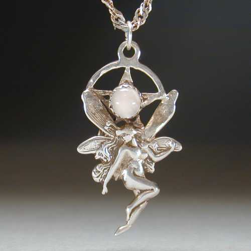Small fairy under a pentagram.  A Moonstone is set in the center of the pentagram.