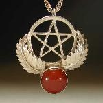 The pentagram has long been associated with protection in many cultures. The knights of the crusades had the star placed on their shields as a protective talisman. Where the symbol of the cross represented the Christ’s suffering the pentacle represented his protection. This Sterling silver piece is set with a 12mm round carnelian, a popular stone from ancient Egypt through the middle ages, and the Renaissance. This stone is associated with protection and courage.