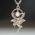 Small fairy under a pentagram.  A Moonstone is set in the center of the pentagram.